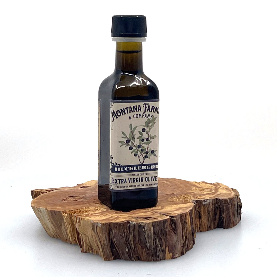100 ml bottle of Montana Huckleberry Extra Virgin Olive Oil, made in Montana by Montana Pharmacy