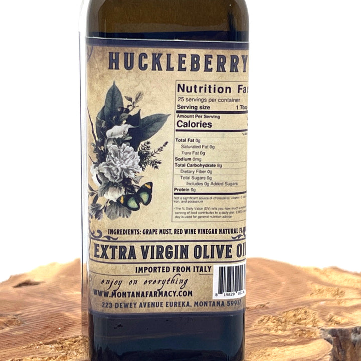 100 ml bottle of Montana Huckleberry Extra Virgin Olive Oil, made in Montana by Montana Pharmacy, ingredients