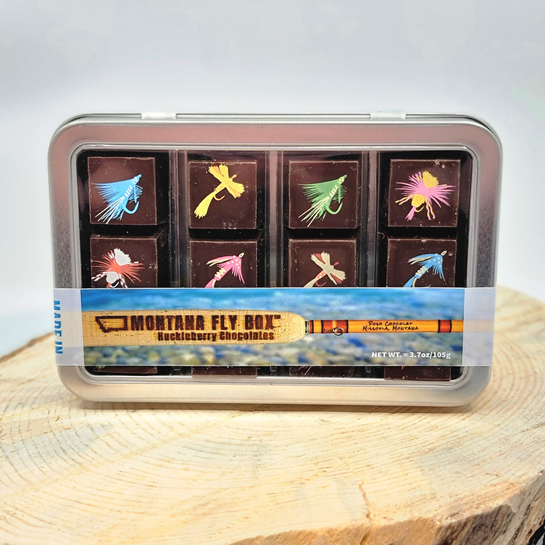 Posh Chocolat's Montana Fly Box - Dark Chocolate Huckleberry Bonbons, a metal tin with 12 artisanal chocolates made in Missoula, Montana