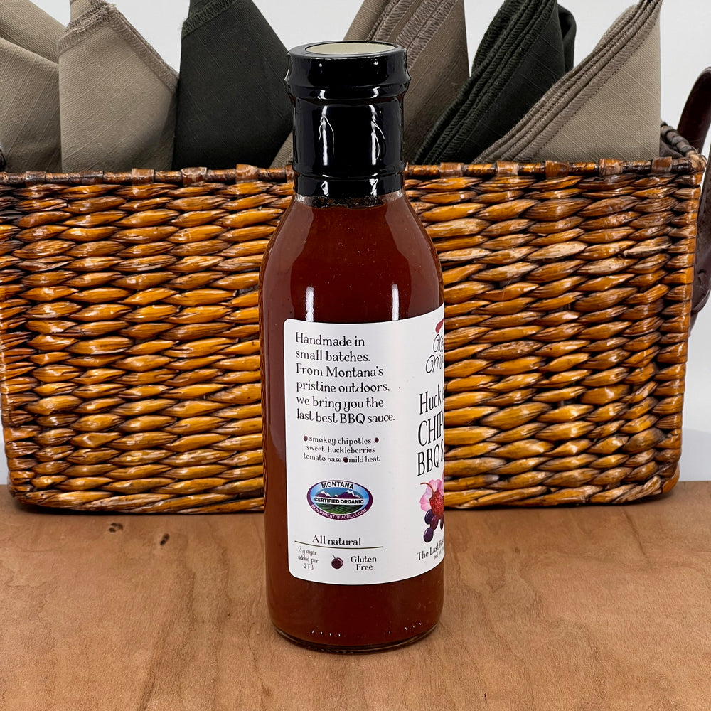 Key to the Mountain's Montana made huckleberry chipotle barbecue sauce side view reading handmade in small batches.