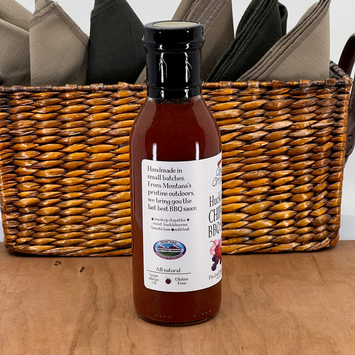 Key to the Mountain's Montana made huckleberry chipotle barbecue sauce side view reading handmade in small batches.