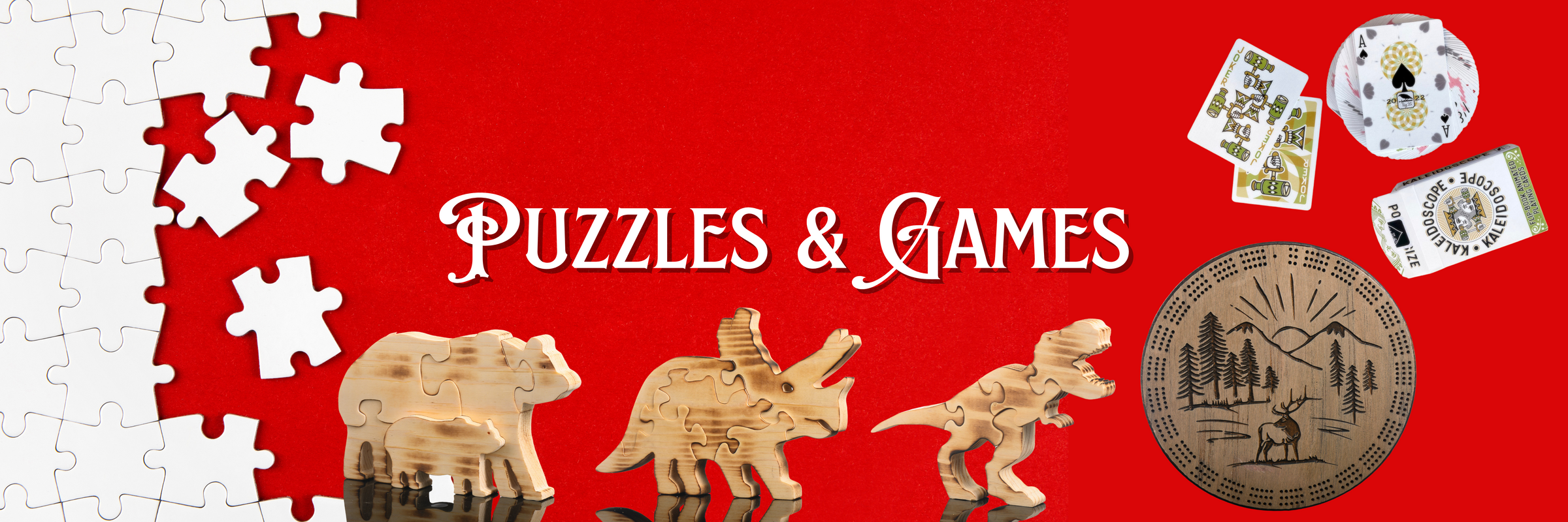 This banner image is red with white puzzle pieces and reads Puzzles & Games. It features images of three wood puzzles, a bear, a triceratops and a t-rex, a cribbage board and a deck of cards. 