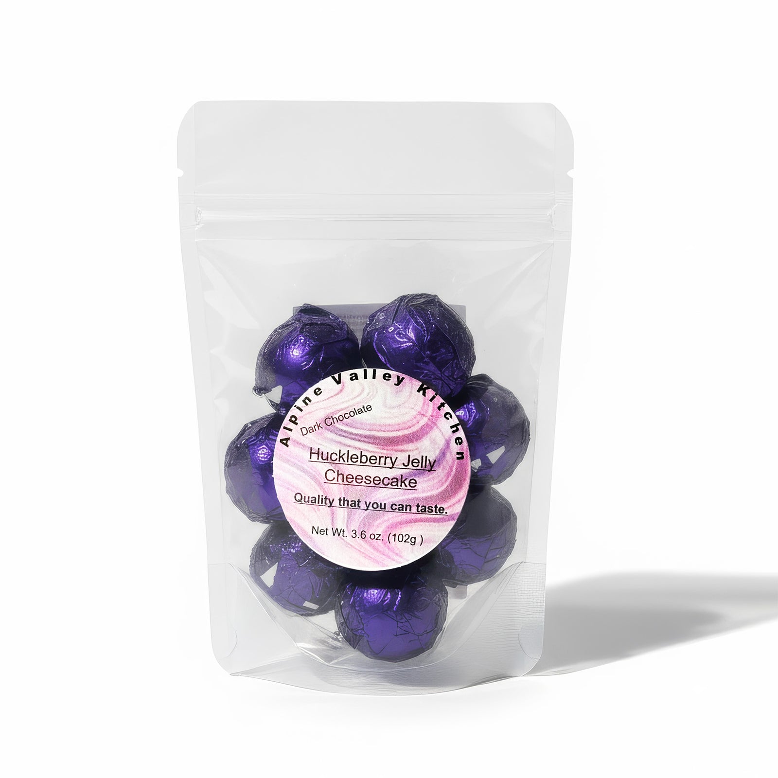 Huckleberry Jelly Cheesecake Dark Chocolate truffles in a clear bag.