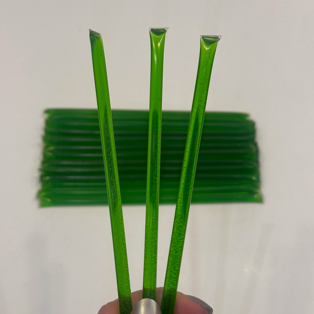 Three green apple flavored honey sticks Made in Montana