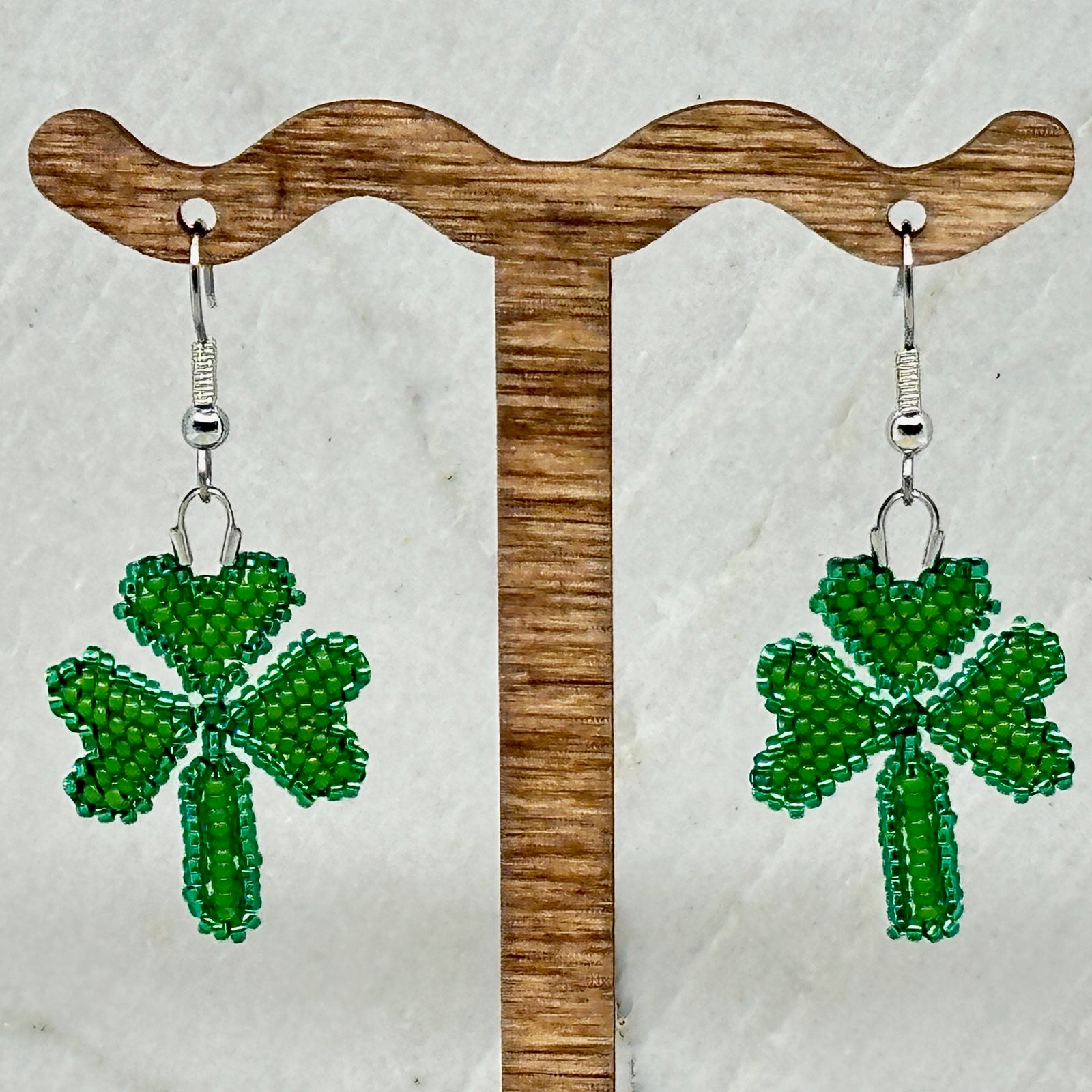 Pair of Shamrock Beaded Earrings with Stainless Steel Wires handmade in Montana USA by Aurum Shimmer, hanging