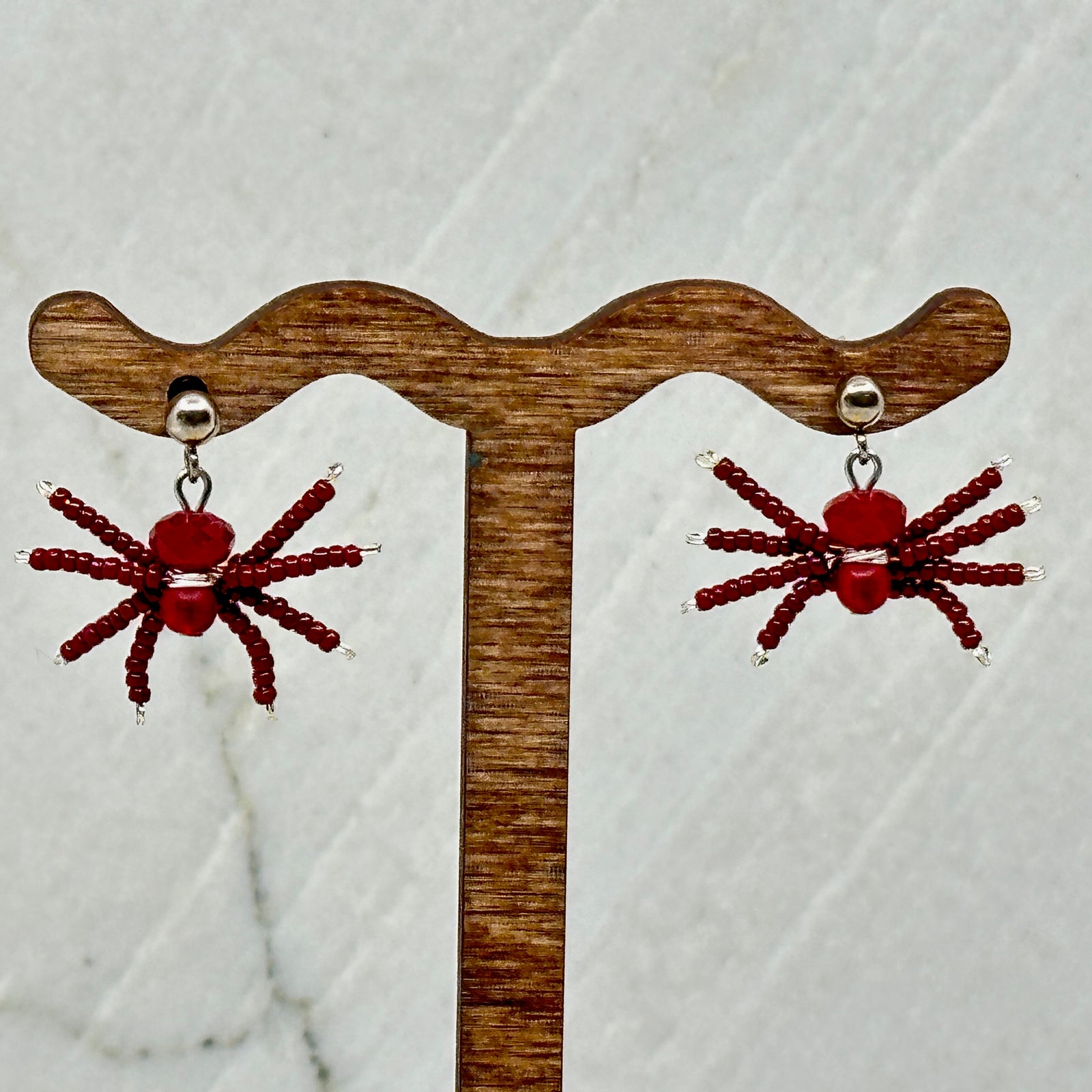 Pair of red Spider Beaded Earrings with Stainless Steel Studs, handmade in Montana USA by Aurum Shimmer
