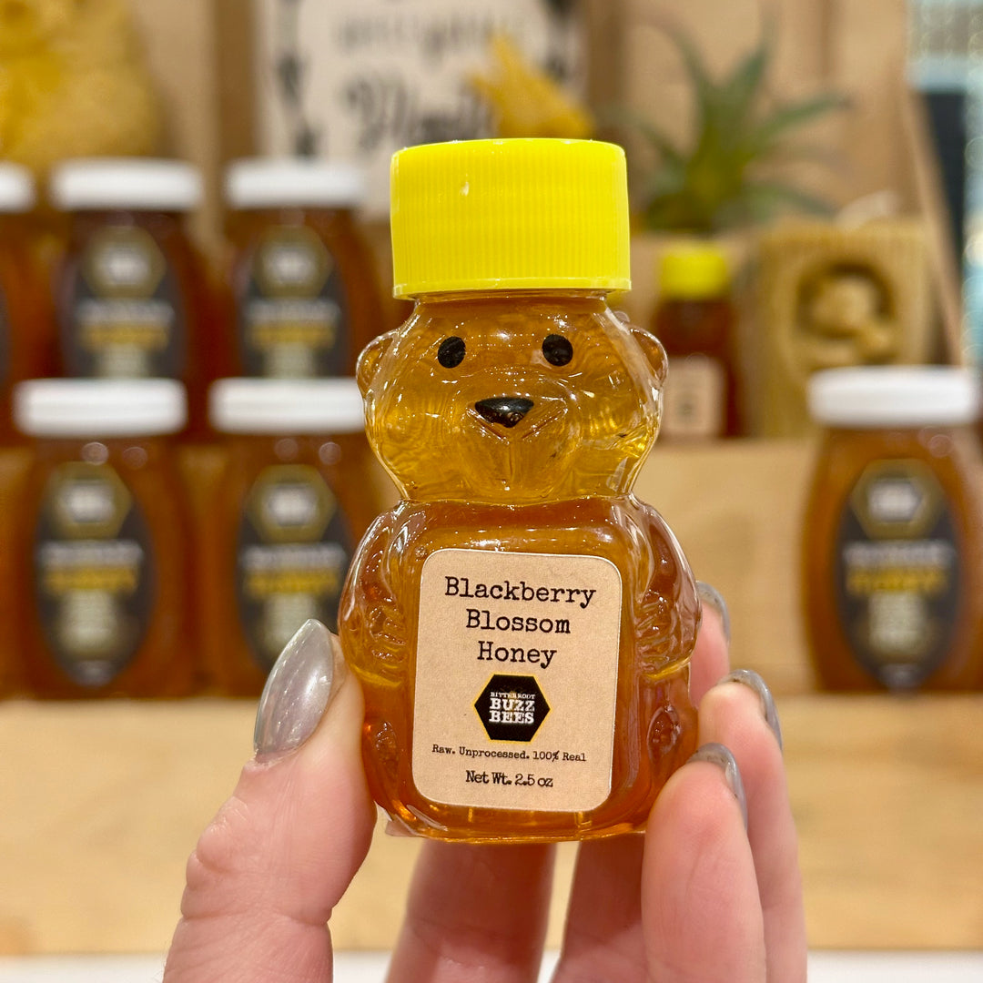 A petite honey bear bottle filled with raw Blackberry Blossom Honey