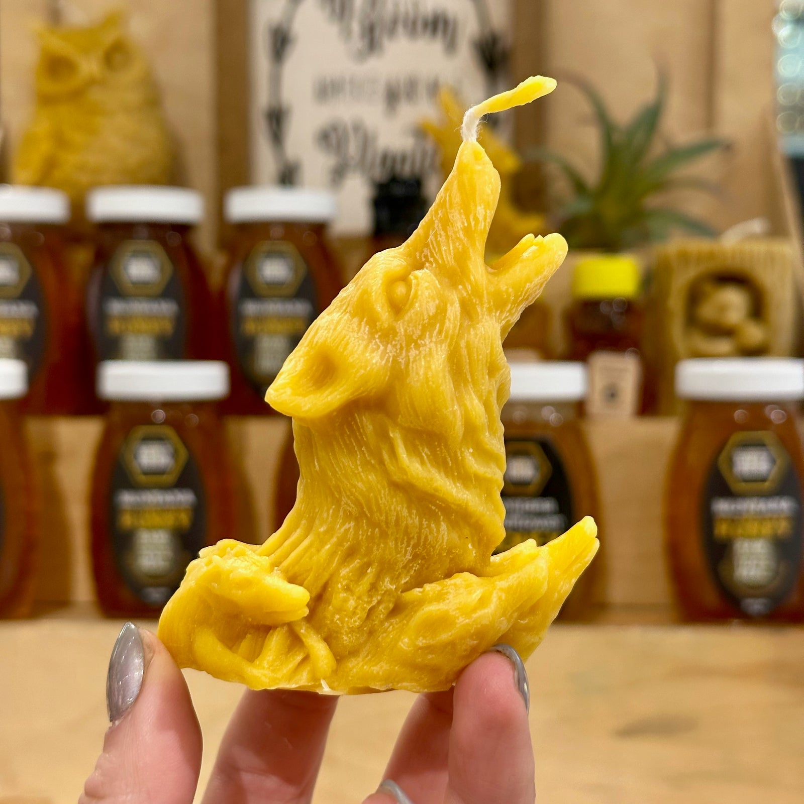 A stunning howling wolf candle made of 100% Montana Beeswax