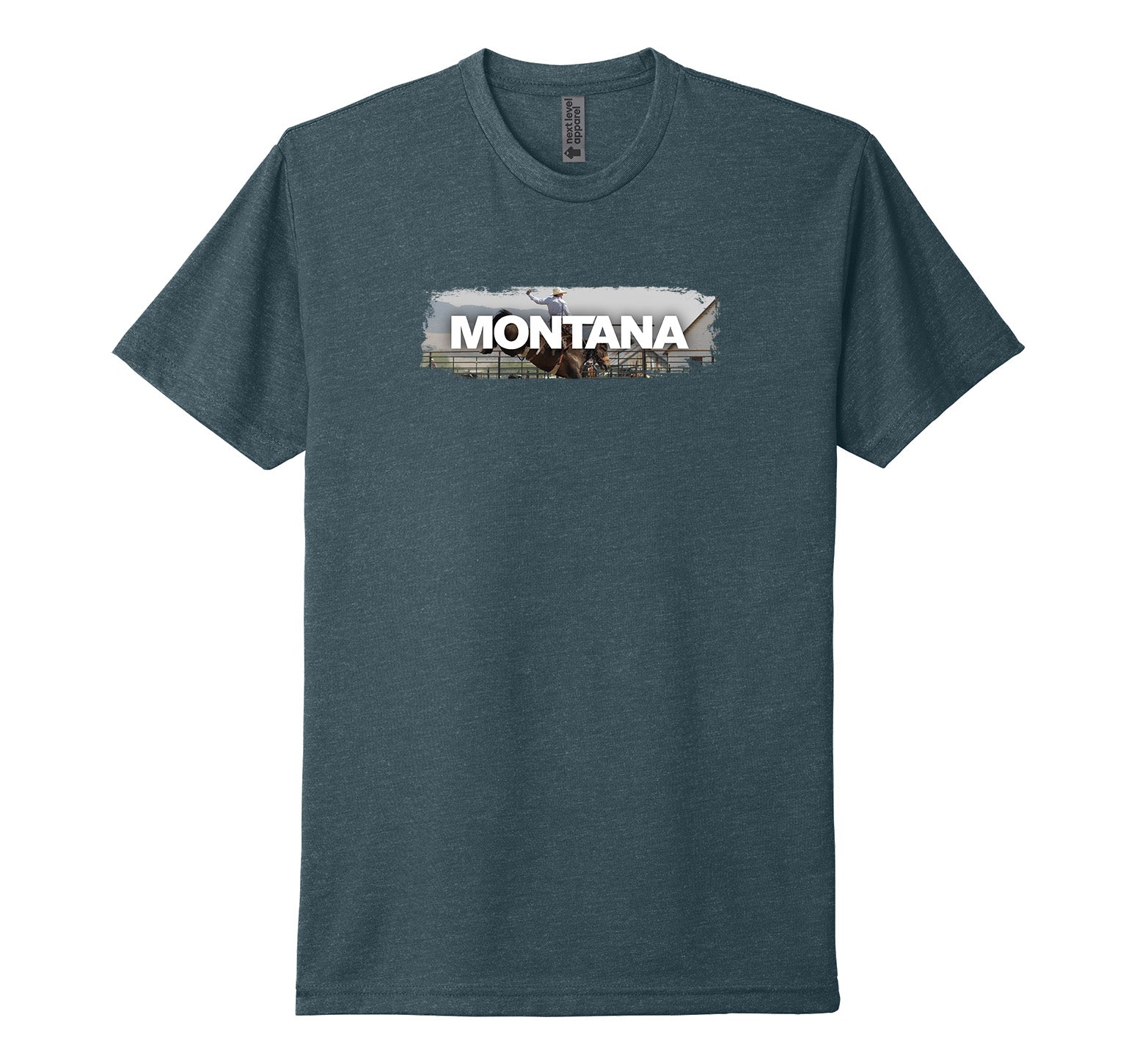 Indigo blue Next Level Apparel unisex adult tee featuring the official MT Department of Commerce ‘Montana’ lettering over the image of a cowboy astride a bucking bronco, designed and printed in Montana by Blue Peak Creative