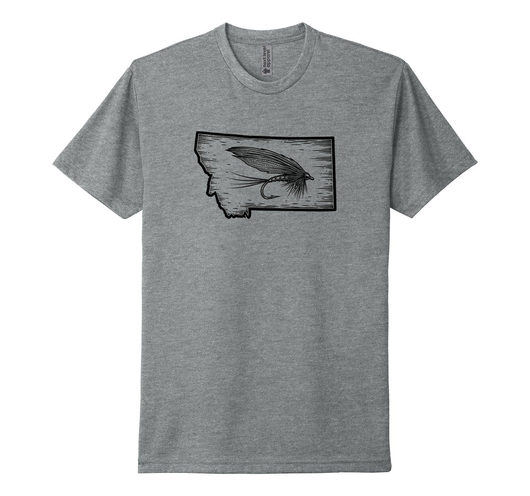 Heather grey Next Level Apparel unisex tee featuring an illustration of the outline of the state of Montana and a detailed fly fishing fly, designed and printed in Montana by Blue Peak Creative