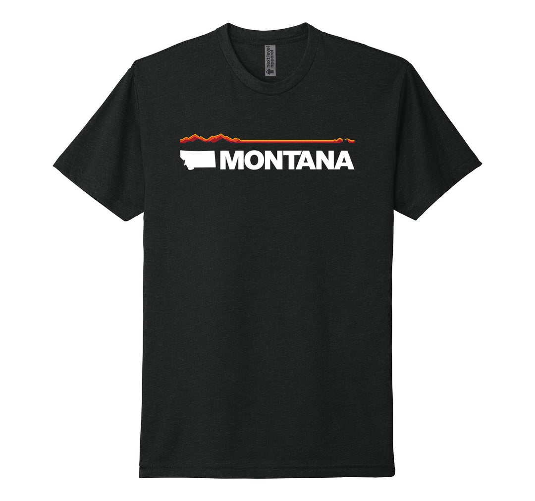 Black Next Level Apparel unisex adult tee featuring the official MT Department of Commerce ‘Montana Brand’—the solid shape of the state and ‘Montana’ lettering—plus a red and orange line representing Montana’s geography (mountains in the west/ left to plains in the east/ right), made in Montana by Blue Peak Creative