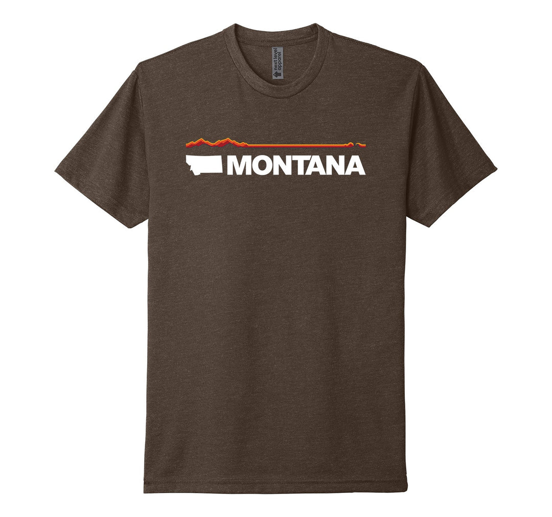 Espresso brown Next Level Apparel unisex adult tee featuring elements of the official MT Department of Commerce ‘Montana Brand’—the solid shape of the state and ‘Montana’ lettering—plus a red and orange line representing Montana’s geography (mountains in the west/ left to plains in the east/ right), made in Montana by Blue Peak Creative