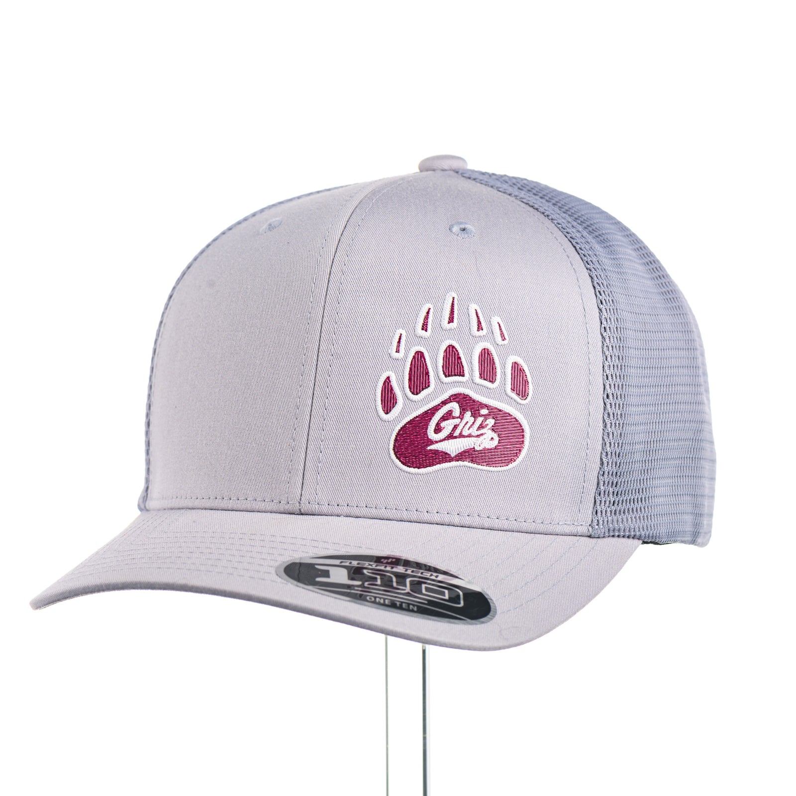 3/4 view of a Paw with Griz - 110® Mesh-Back Cap—a silver and white trucker hat with an embroidered maroon and white UM Griz paw, made in Missoula, Montana (home of the UM Grizzlies) by Blue Peak Creative