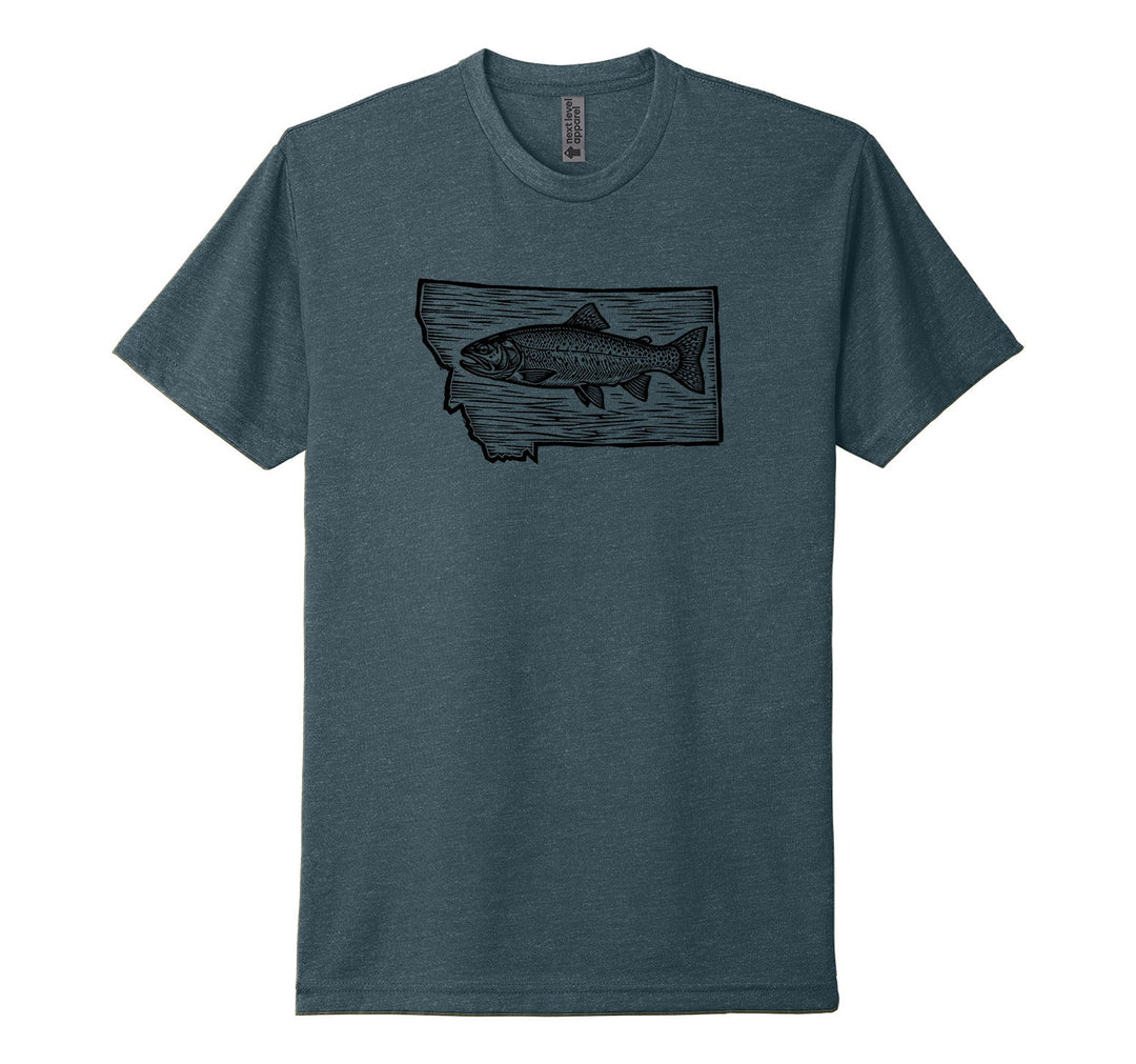 Indigo blue Next Level Apparel unisex tee featuring a woodcut-style illustration of a swimming trout within the outline of the state of Montana, designed and printed in Montana by Blue Peak Creative