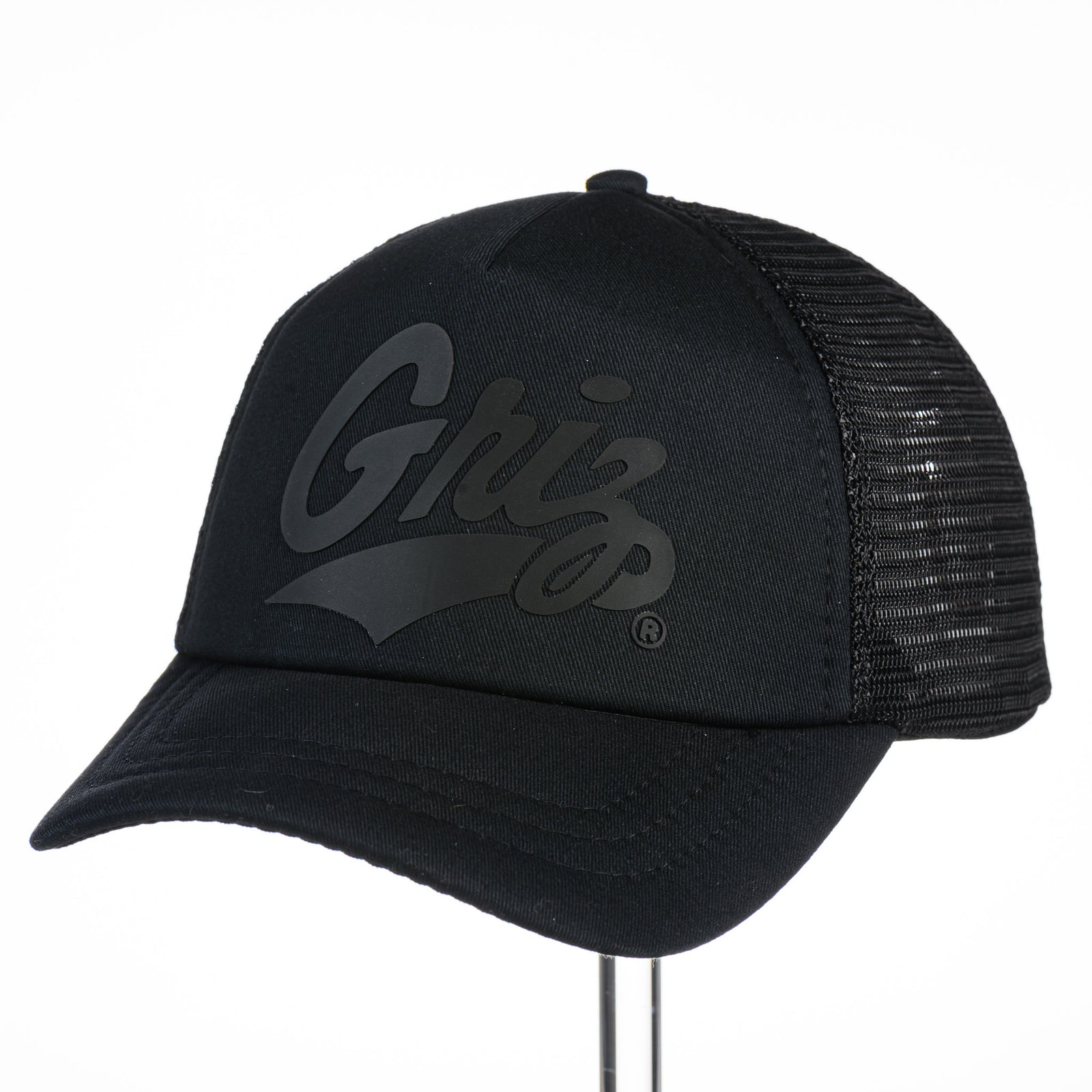Griz Black Vinyl - Foam Trucker Hat made in Missoula, MT (home of the UM Grizzlies) by Blue Peak Creative—a black-on-black foam trucker hat decorated with vinyl University of Montana Griz script (3/4 view)