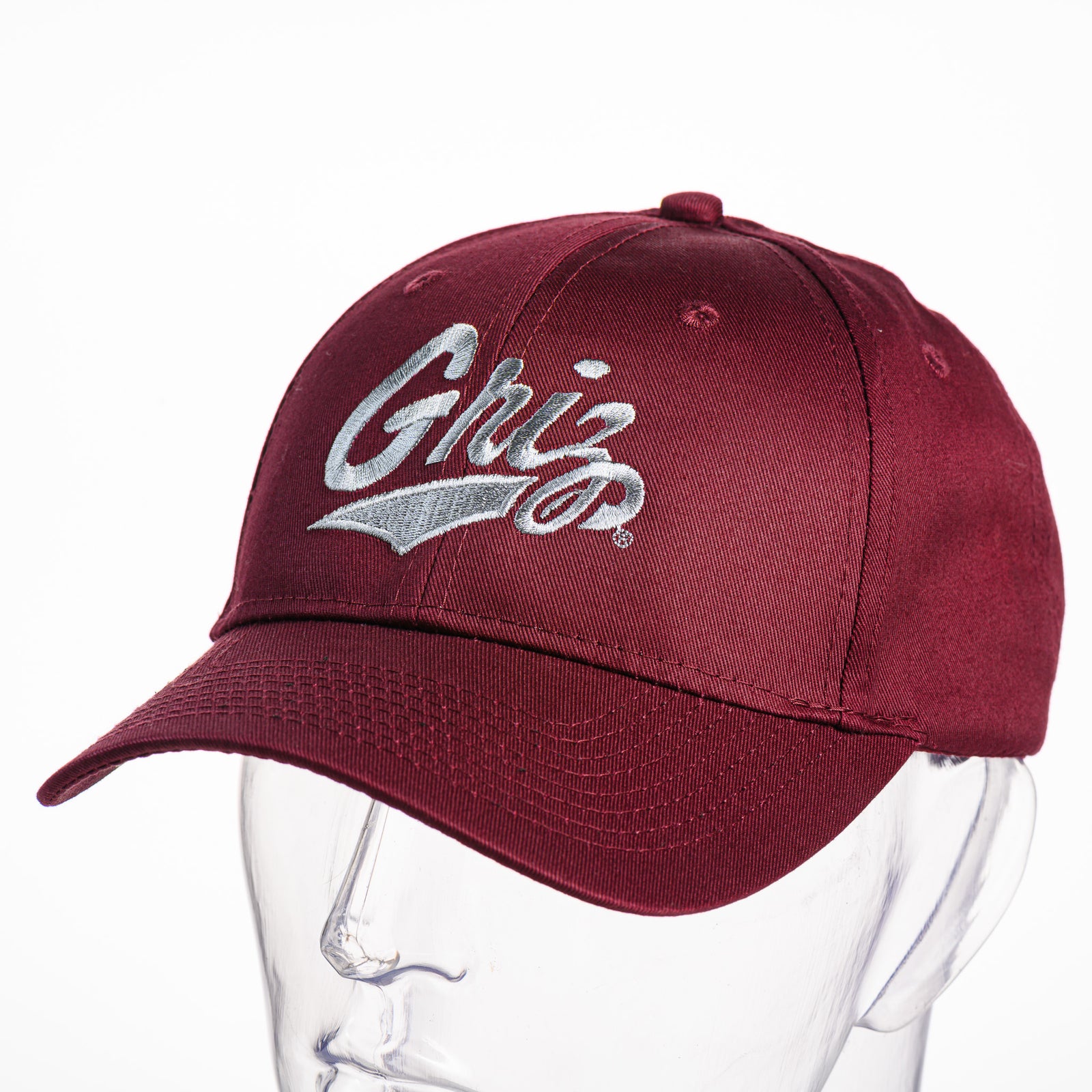 Maroon Griz Script - Six-panel Twill Hat made in Missoula, MT (home of the UM Grizzlies) by Blue Peak Creative—a maroon, six-panel twill baseball cap embroidered with the University of Montana Griz script (3/4 view)