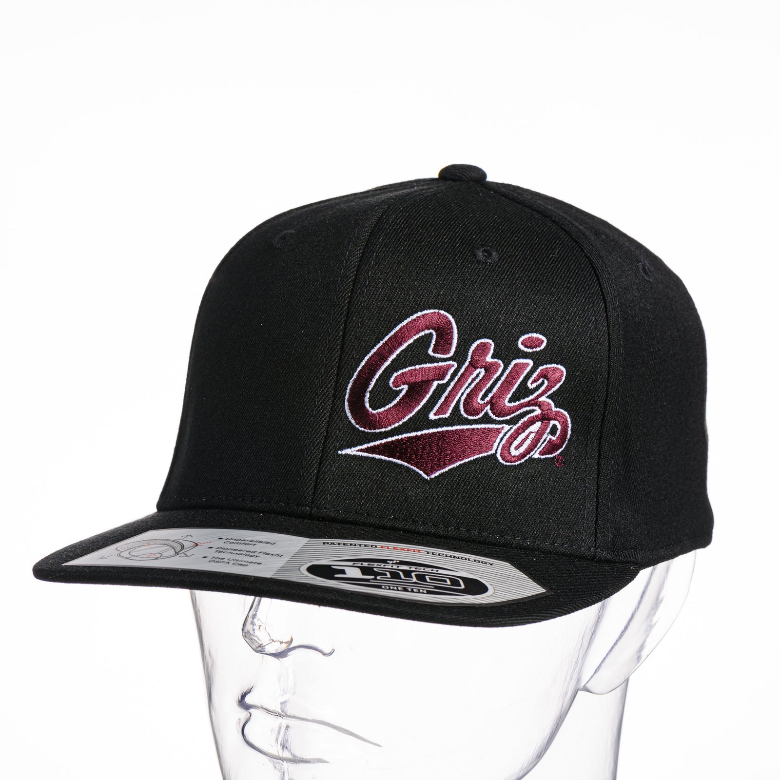 Black Outlined Griz Script - Flexfit Flat Bill Hat made in Missoula, MT (home of the UM Grizzlies) by Blue Peak Creative—a black flat bill hat embroidered with the outlined maroon University of Montana Griz script (3/4 view).