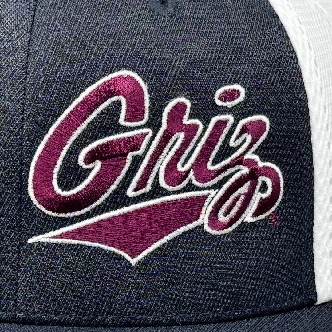 Black and white Outlined Griz Script - Ultrafibre and Airmesh Flexfit Hat made in Missoula, MT (home of the UM Grizzlies) by Blue Peak Creative—a black and white Ultrafibre and Airmesh Flexfit Hat embroidered with the Outlined Griz Script in maroon and white (detail)