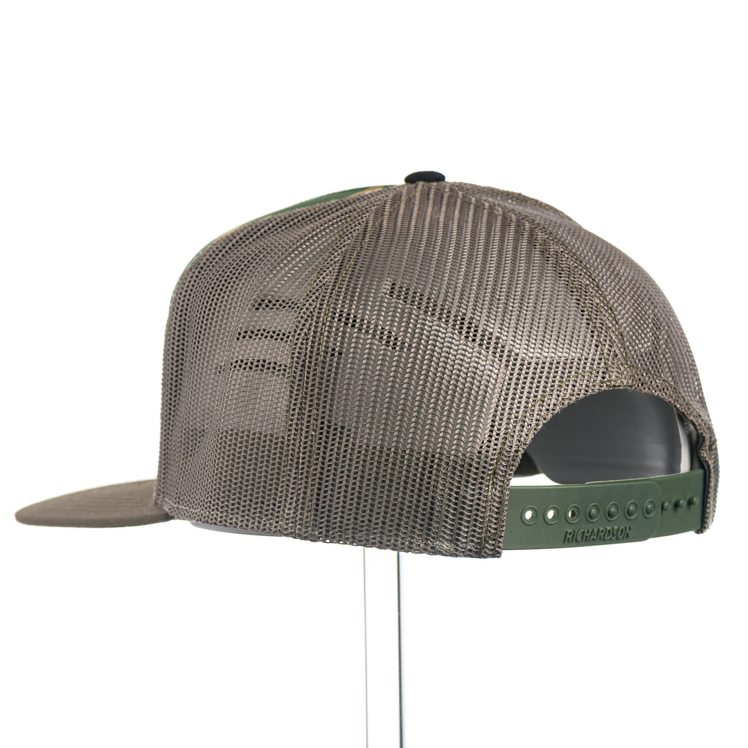 Trucker cap with mesh back and green brim on a white background with a Griz Leather Patch