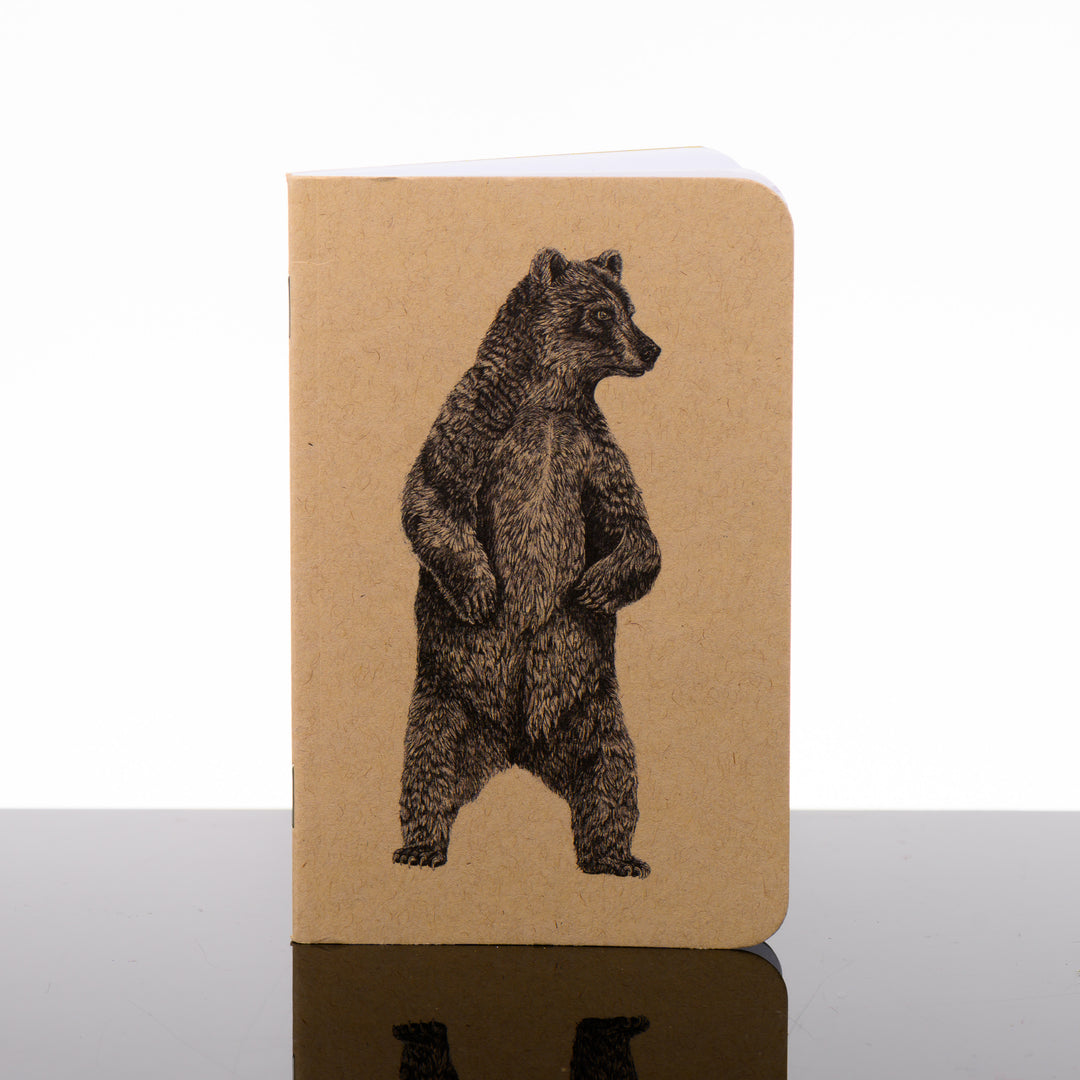 Pocket journal with a brown Kraft cover featuring original black and white artwork by Brittany Finch - a bear standing on its hind legs - handmade by Brittany Finch Art in Montana