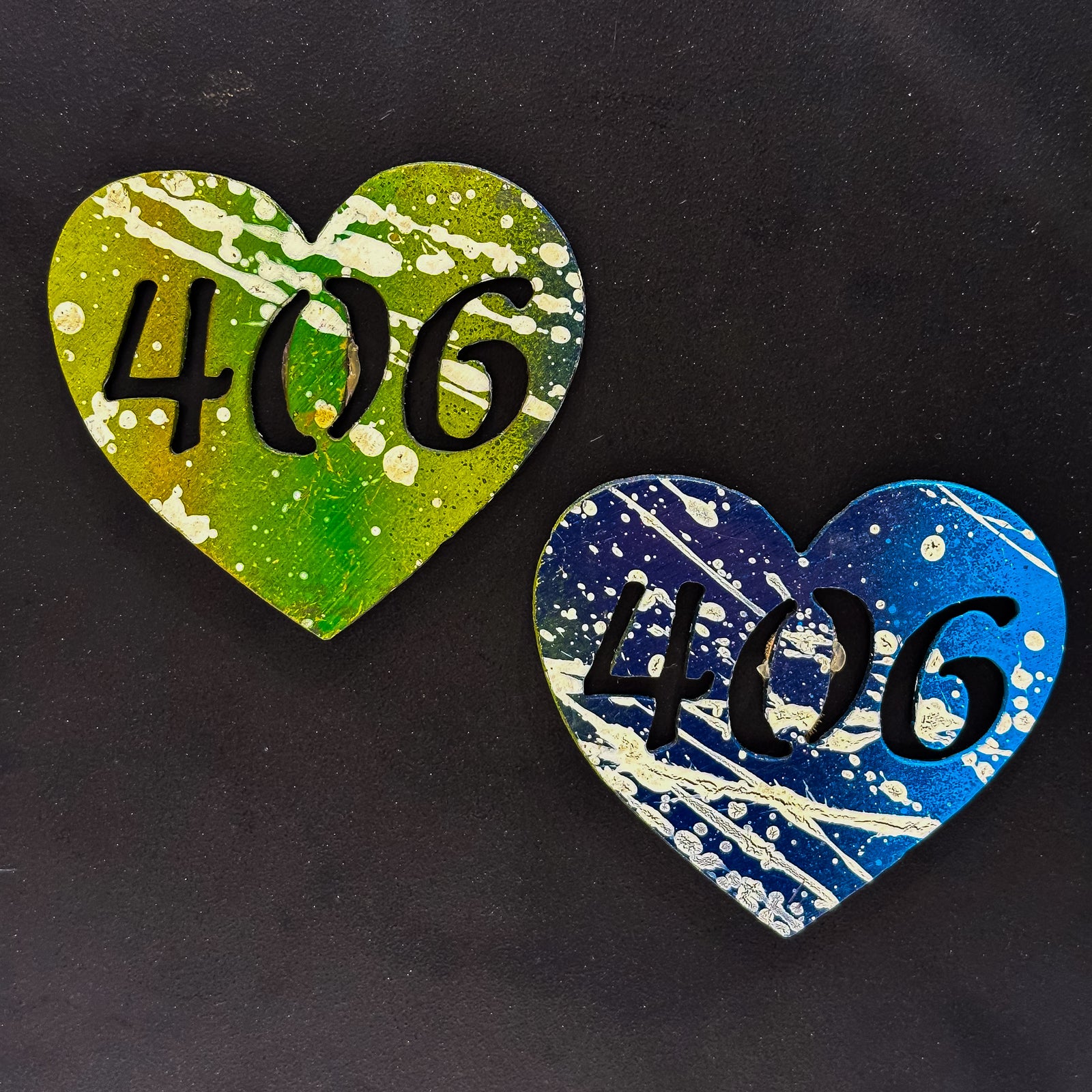 A made in Montana heart-shaped cut-out with a silhouette of the 406 area code embedded in it and a strong back magnet.