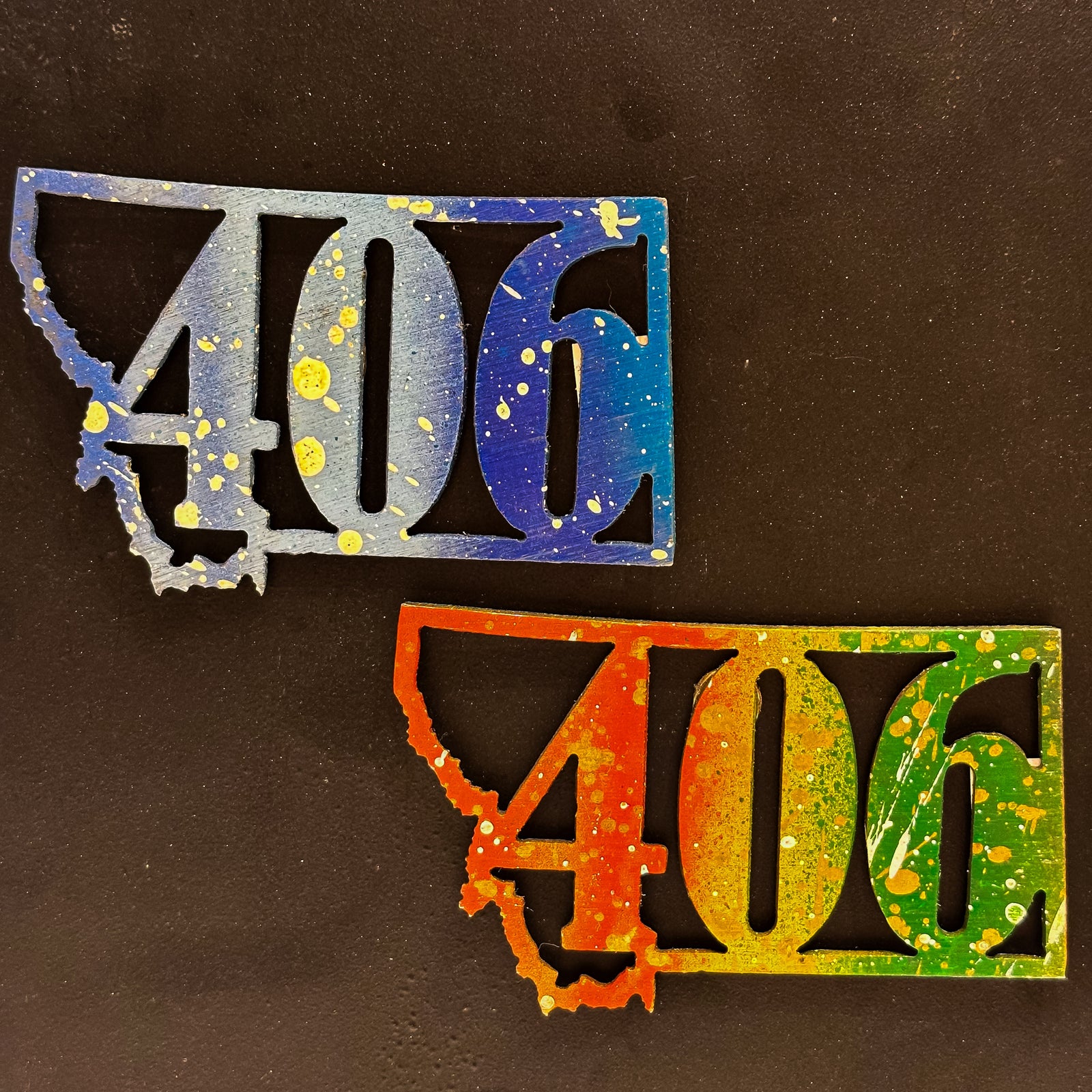 A made in Montana state-shaped cut-out with the area code 406 embedded in it and a strong back magnet.
