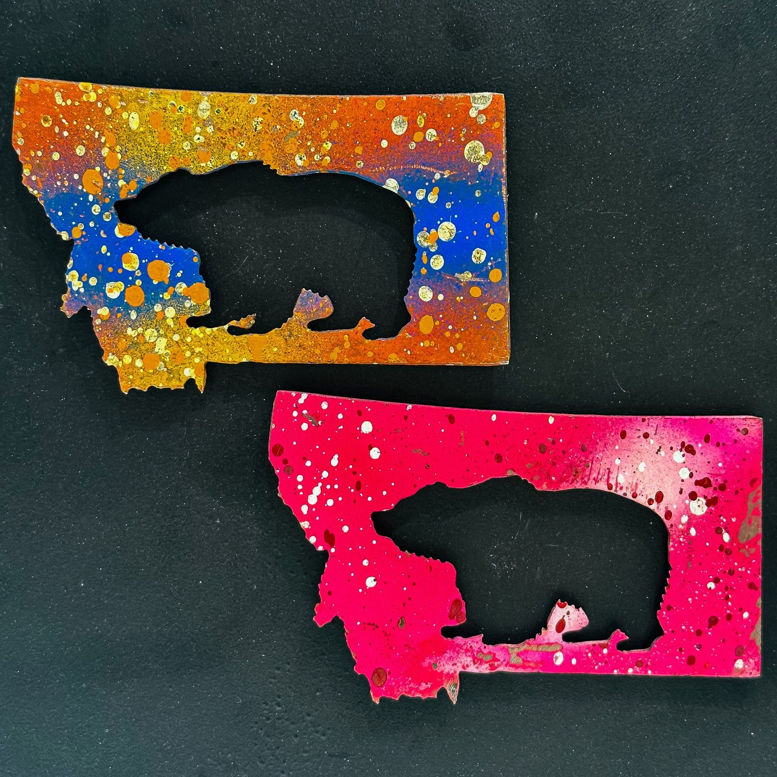 A made in Montana state-shaped cut-out with a bear silhouette embedded in it and a strong back magnet.