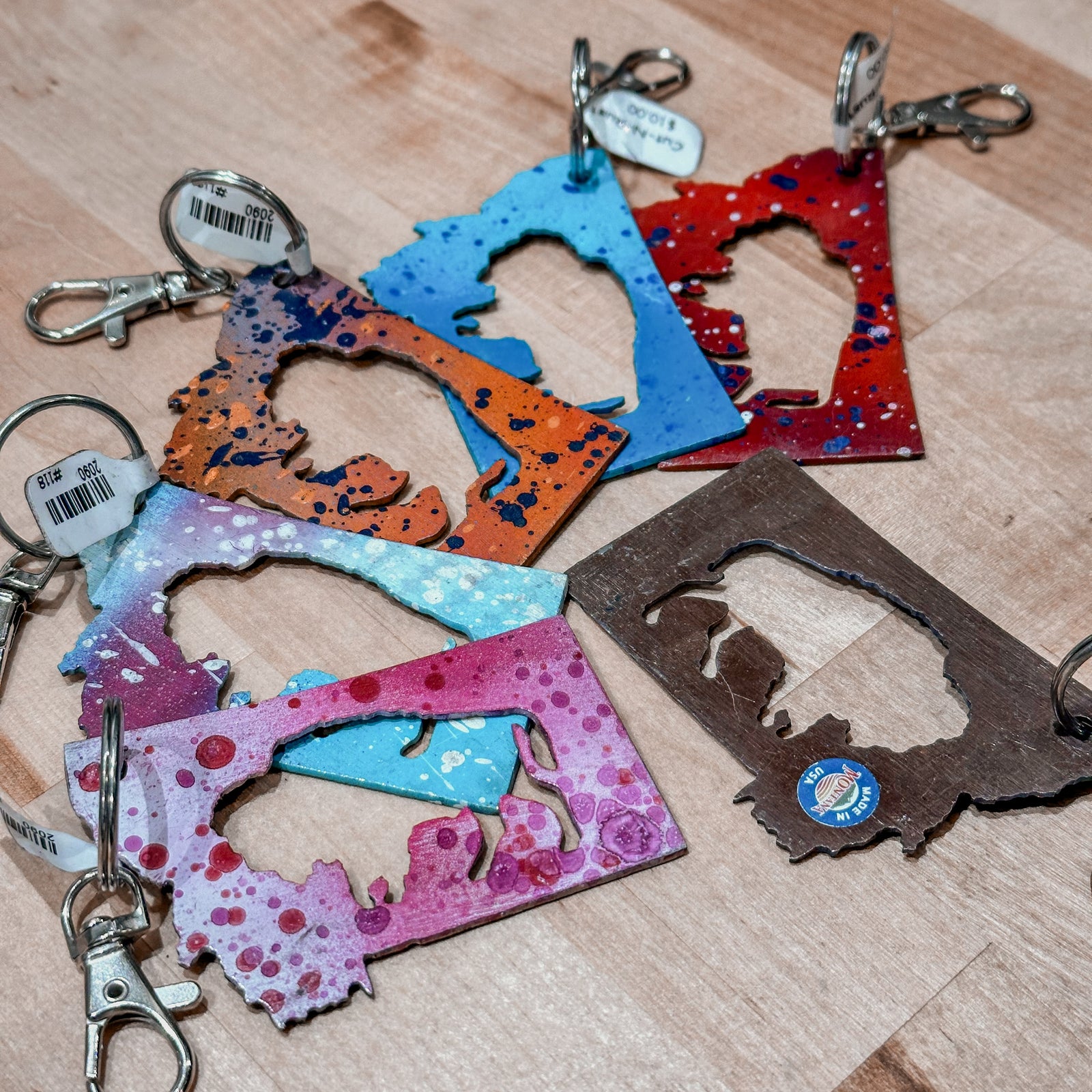 This made in Montana Bison Metal Keychain showcases a state-shaped design with a bison cutout in the center.