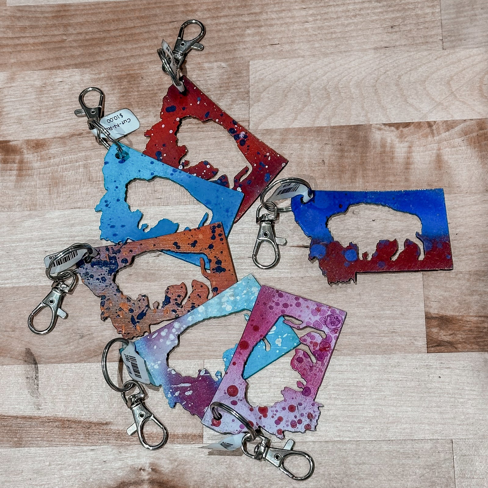 This made in Montana Bison Metal Keychain showcases a state-shaped design with a bison cutout in the center.