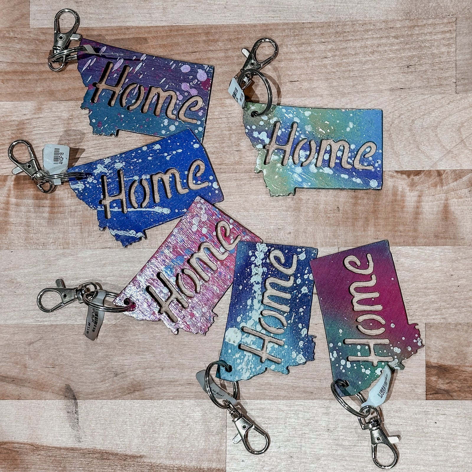 This made in Montana Home Metal Keychain showcases a state-shaped design with the word Home cut out of it.