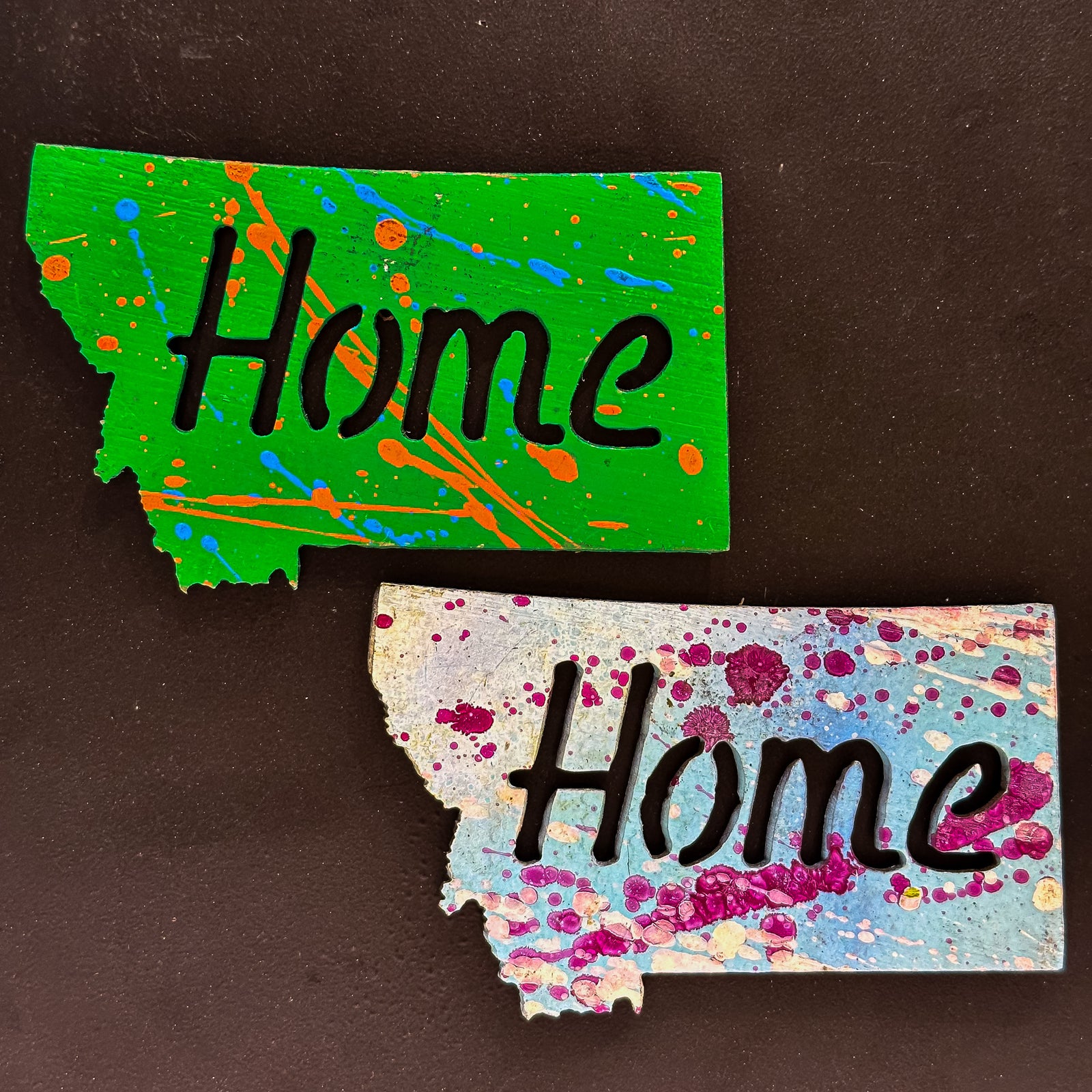 A made in Montana state-shaped cut-out with the word Home embedded in it and a strong back magnet.