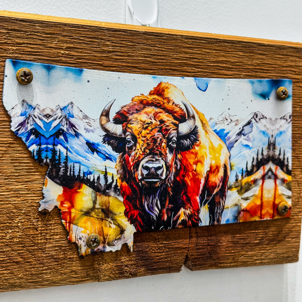 This Metal and wood plaque is in the shape of Montana with a vibrant print of a Bison. Made in Montana.