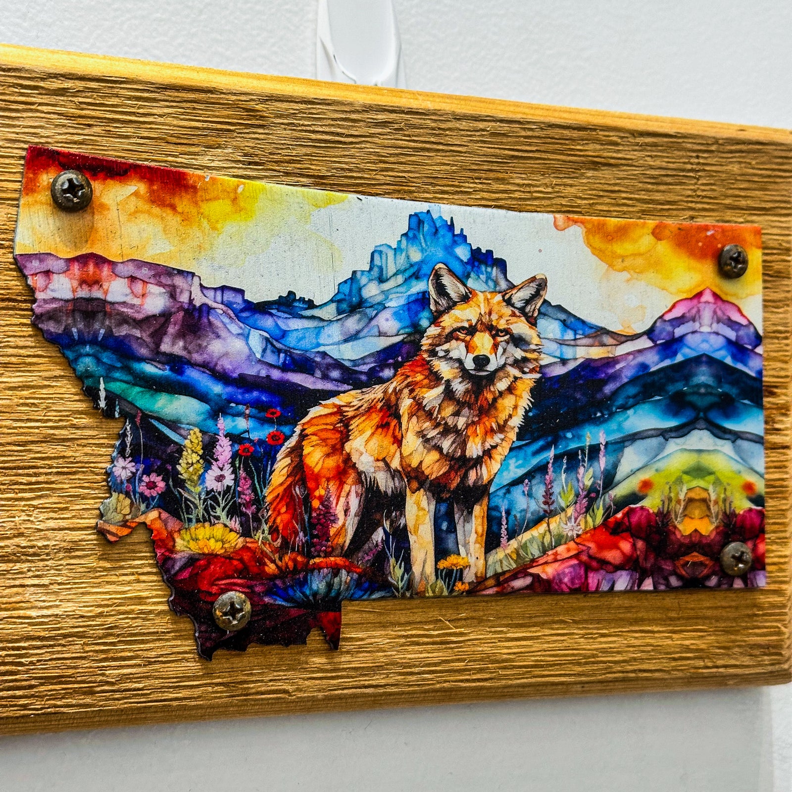 This Metal and wood plaque is in the shape of Montana with a vibrant print of a Fox. Made in Montana.