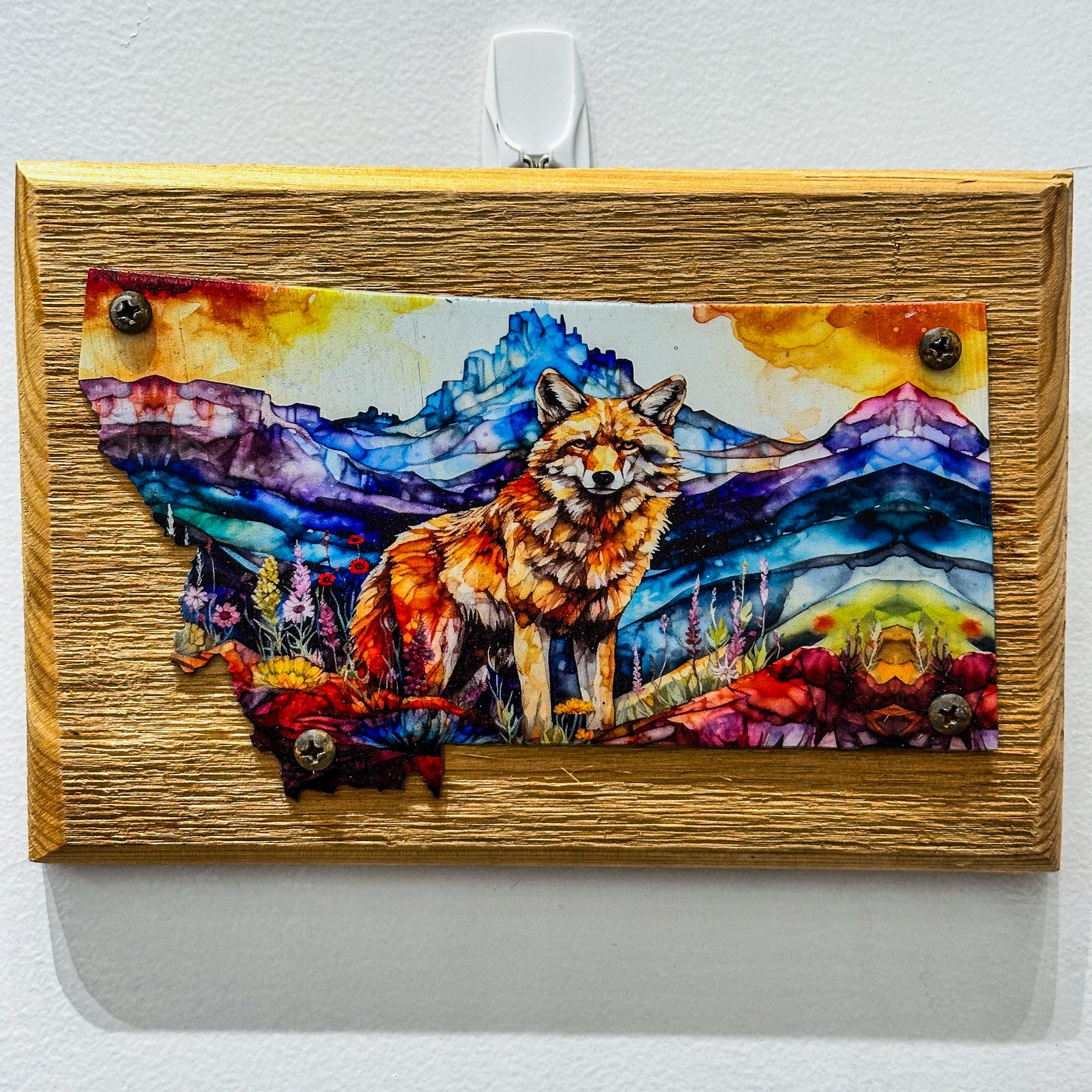 This Metal and wood plaque is in the shape of Montana with a vibrant print of a Fox. Made in Montana.