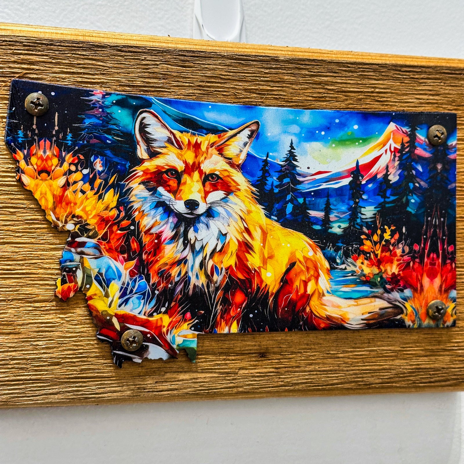 This Metal and wood plaque is in the shape of Montana with a vibrant print of a fox. Made in Montana.