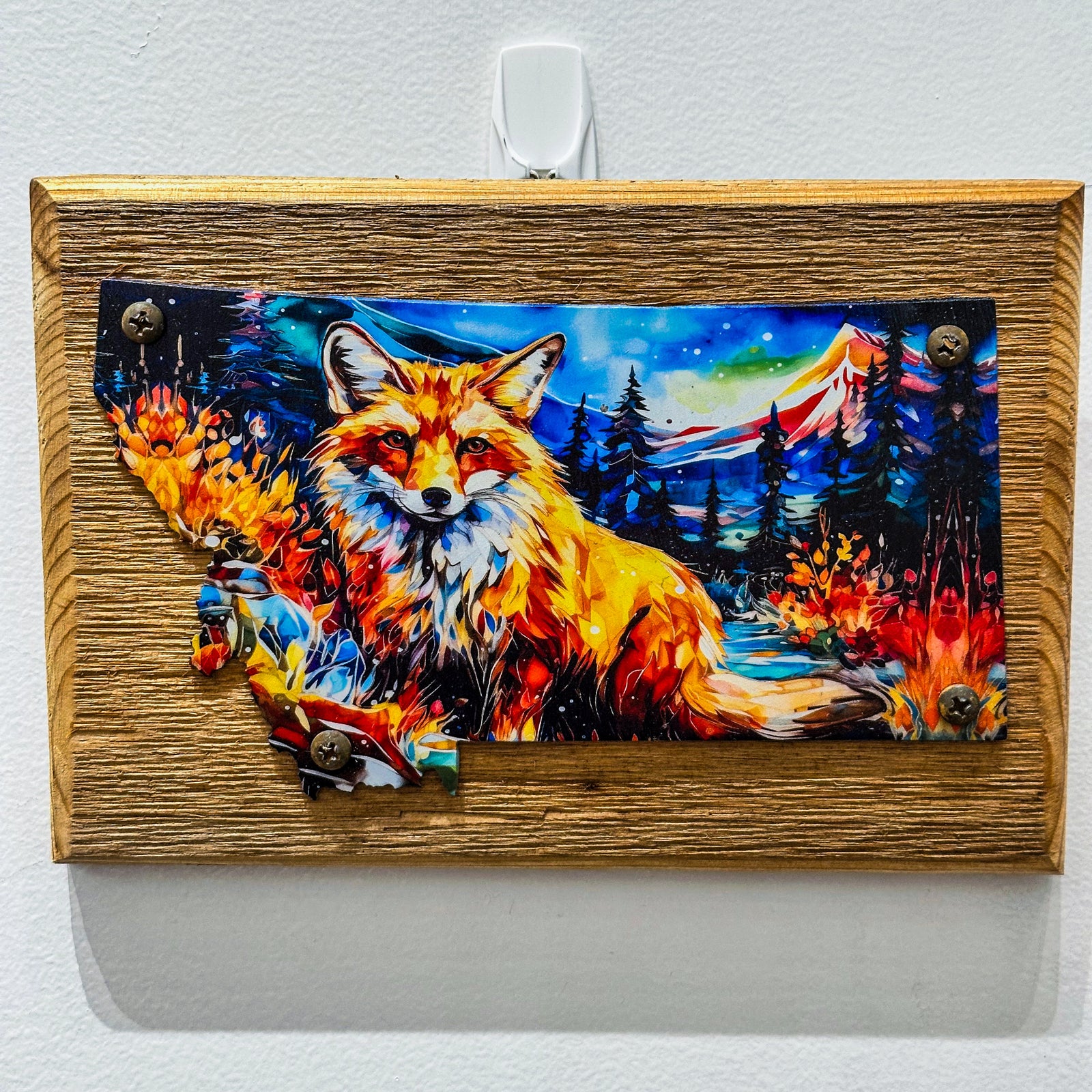 This Metal and wood plaque is in the shape of Montana with a vibrant print of a fox. Made in Montana.