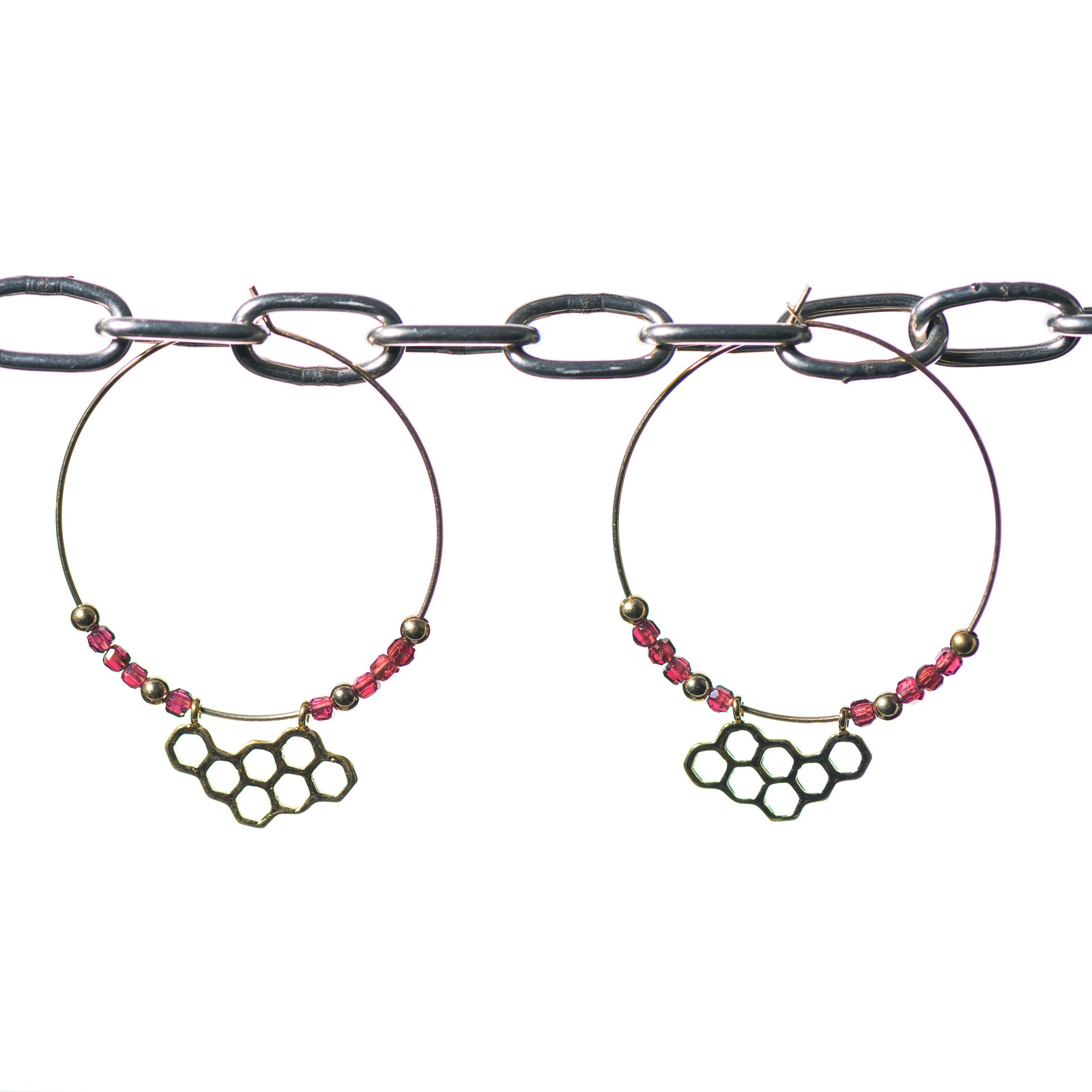 Cobblestone Designs of Montana's Honeycomb Earrings--fine metal (sterling silver) honeycomb dangle and garnet beads on an elegant gold filled hoop, handcrafted in Montana
