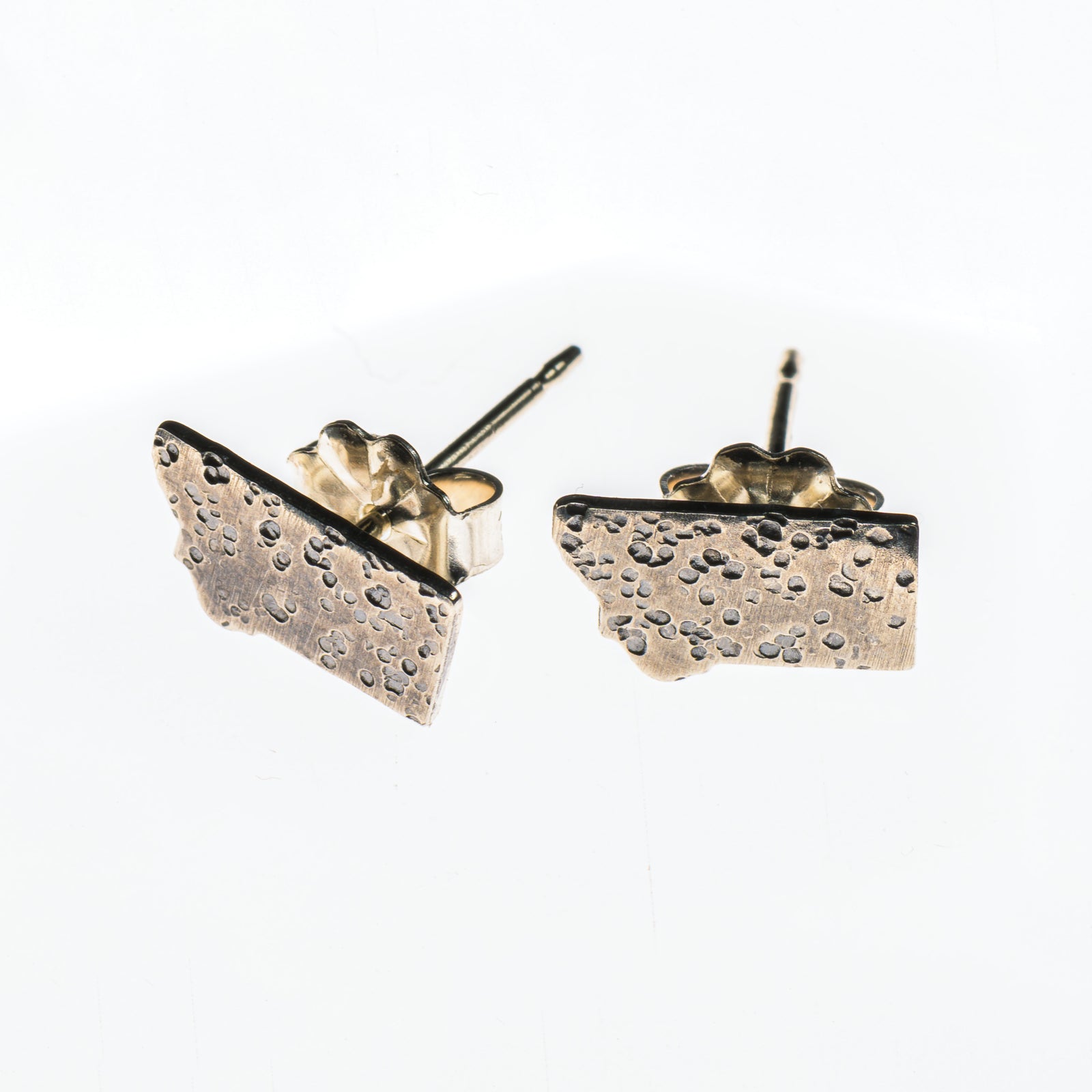 Cobblestone Designs of Montana's Montana Stud Earrings - lightly hammered sterling silver stud earrings in the shape of Montana, made in Montana