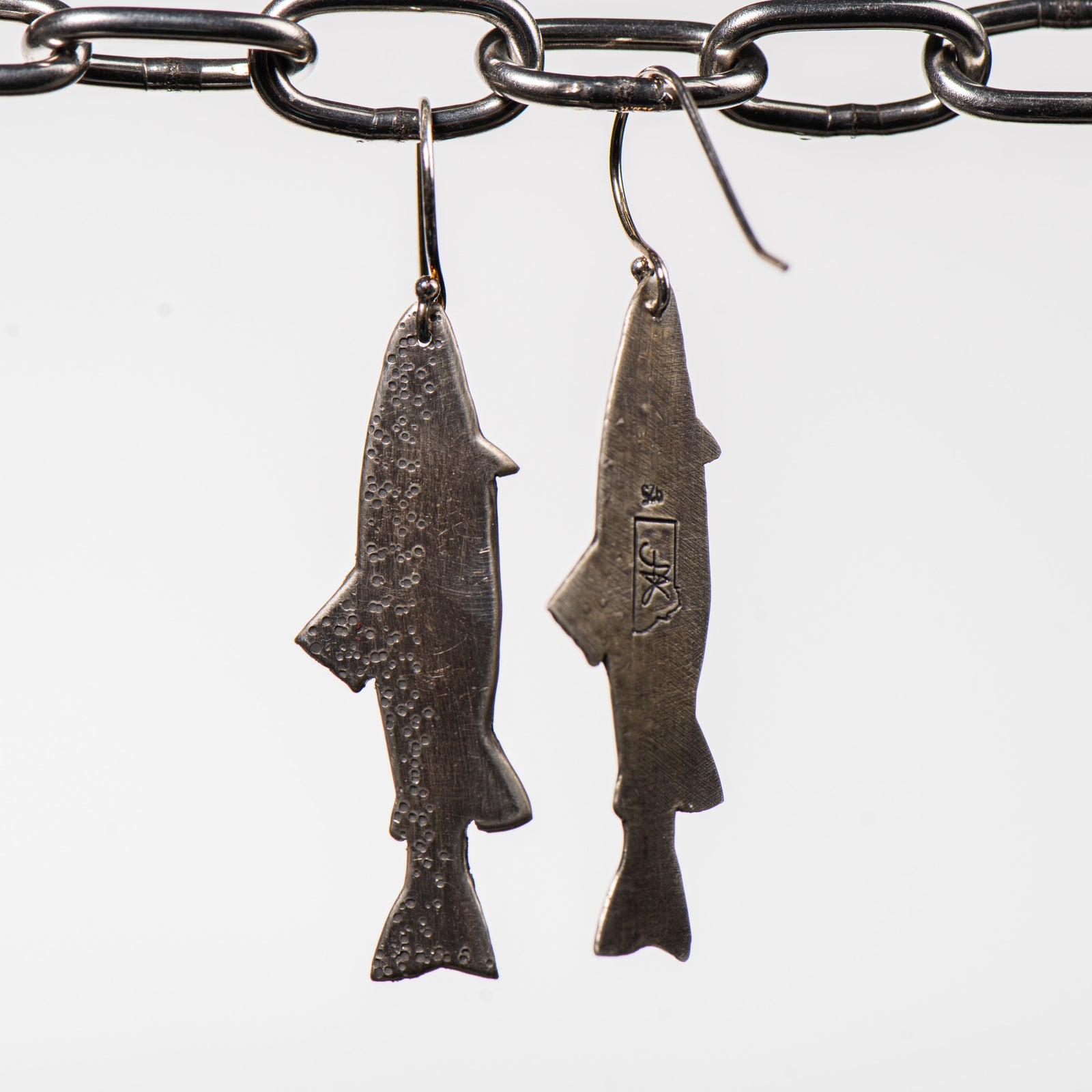 Cobblestone Designs of Montana's Trout Earrings - Sterling Silver fish-shaped dangles handcrafted in Montana