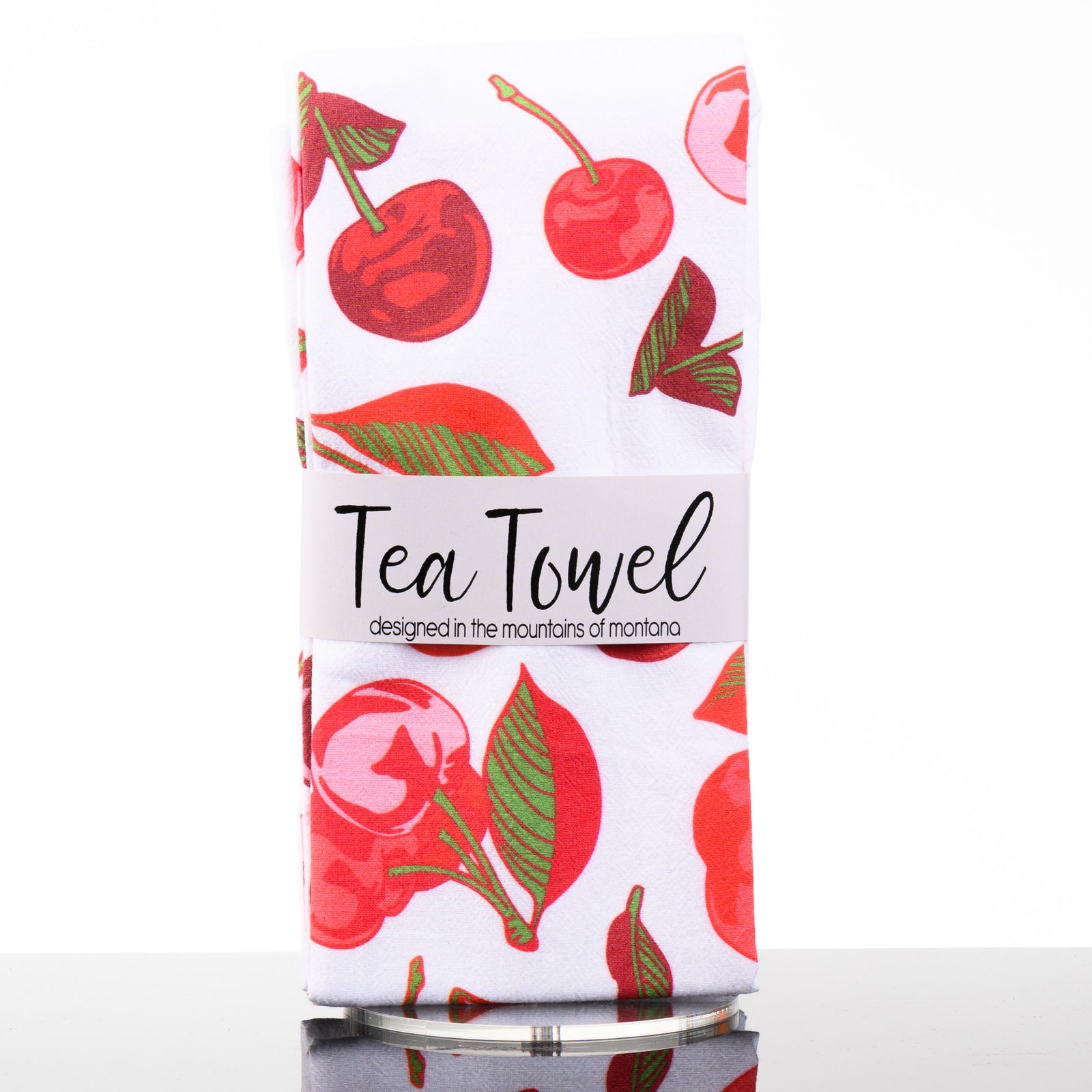 This tea towel features an all over print of drawings of cherries, designed in the mountains of Montana by Corvidae.