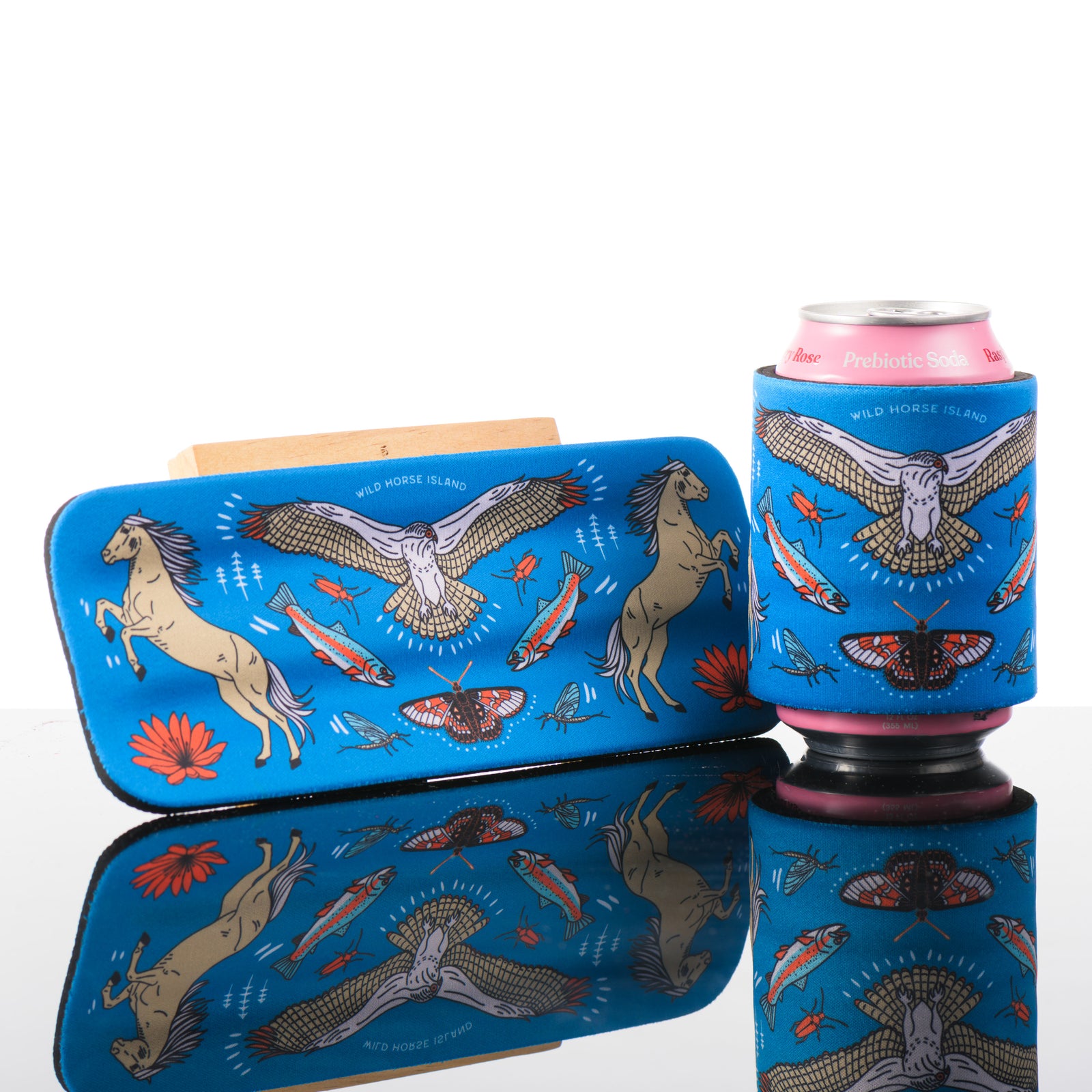 This blue slap can cooler features artwork inspired by wild horse Island in Montana.