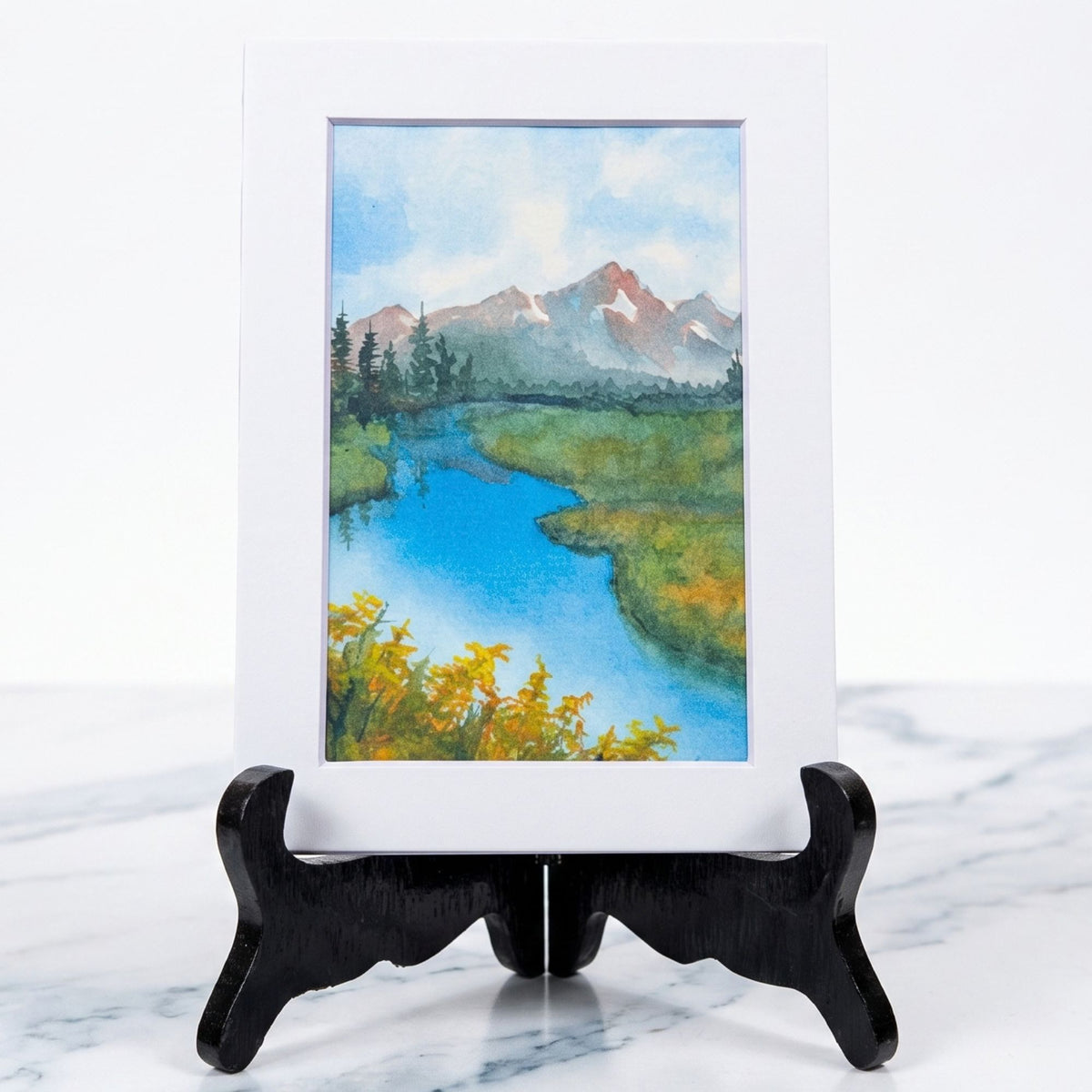 Goldenrod Morning Matted Print: A serene 5x7 Bobbe Almer watercolor reproduction of a Montana mountain landscape with a river and yellow wildflowers. Made in USA.