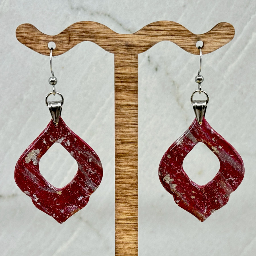 Pair of University of MT Grizzlies Themed polymer clay Arabesque Earrings (large) by Bitterroot Shining Creations, featuring maroon and silver polymer clay, hanging