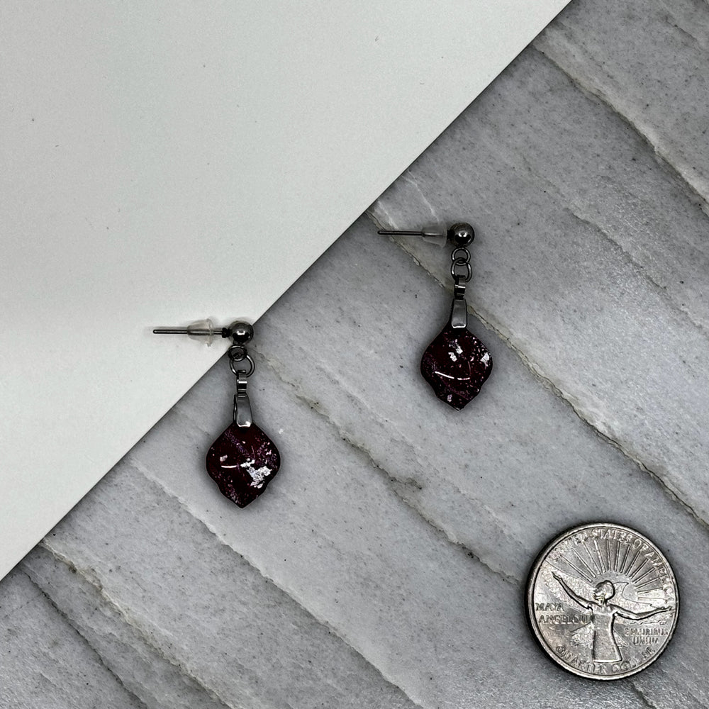 Pair of Small Arabesque Earrings with University of Montana Grizzlies colors by Bitterroot Shining Creations, featuring maroon and silver polymer clay, with scale