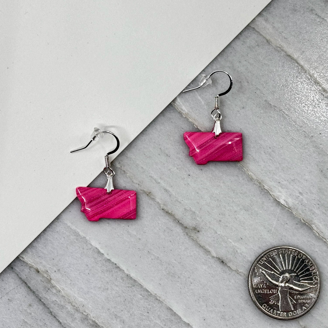 Pair of small, polymer clay Montana Earrings by Bitterroot Shining Creations in assorted sparkly colors (hot pink), with scale