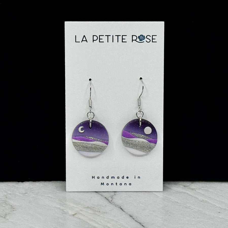 Pair of La Petite Rose's Purple Sun Moon Landscape Clay Earrings, on card