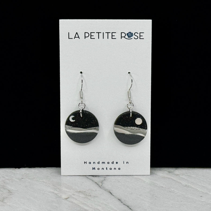 Pair of La Petite Rose's Midnight Black Landscape Clay Earrings, on card