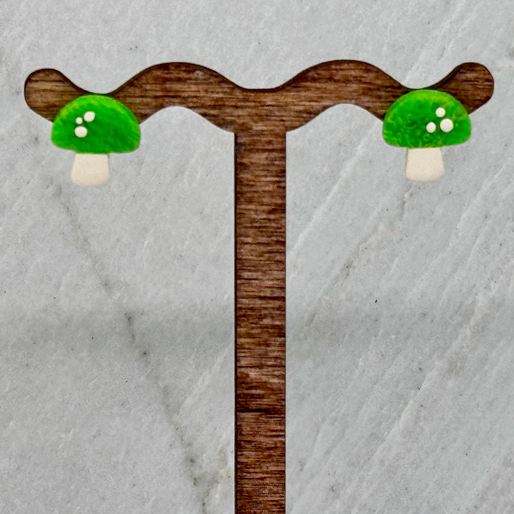 Pair of La Petite Rose Polymer Clay Green Mushroom Stud Earrings, hanging