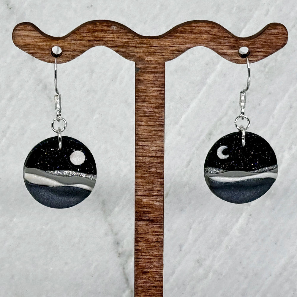 Pair of La Petite Rose's Midnight Black Landscape Clay Earrings, hanging