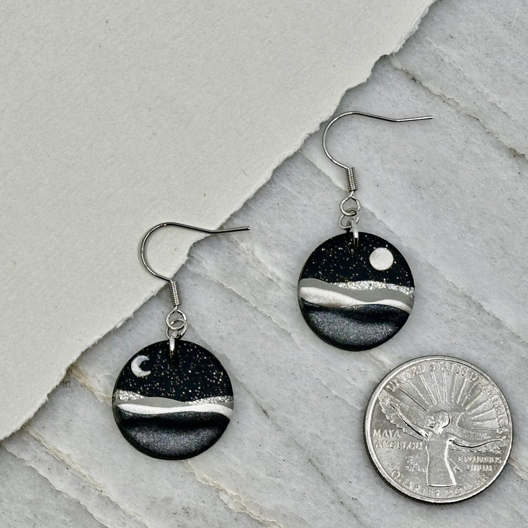Pair of La Petite Rose's Midnight Black Landscape Clay Earrings, with scale